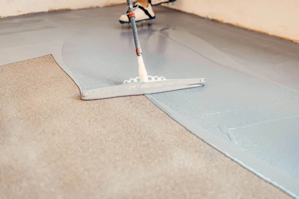 Spreading Epoxy with a Squeegee Houston Floor Coatings