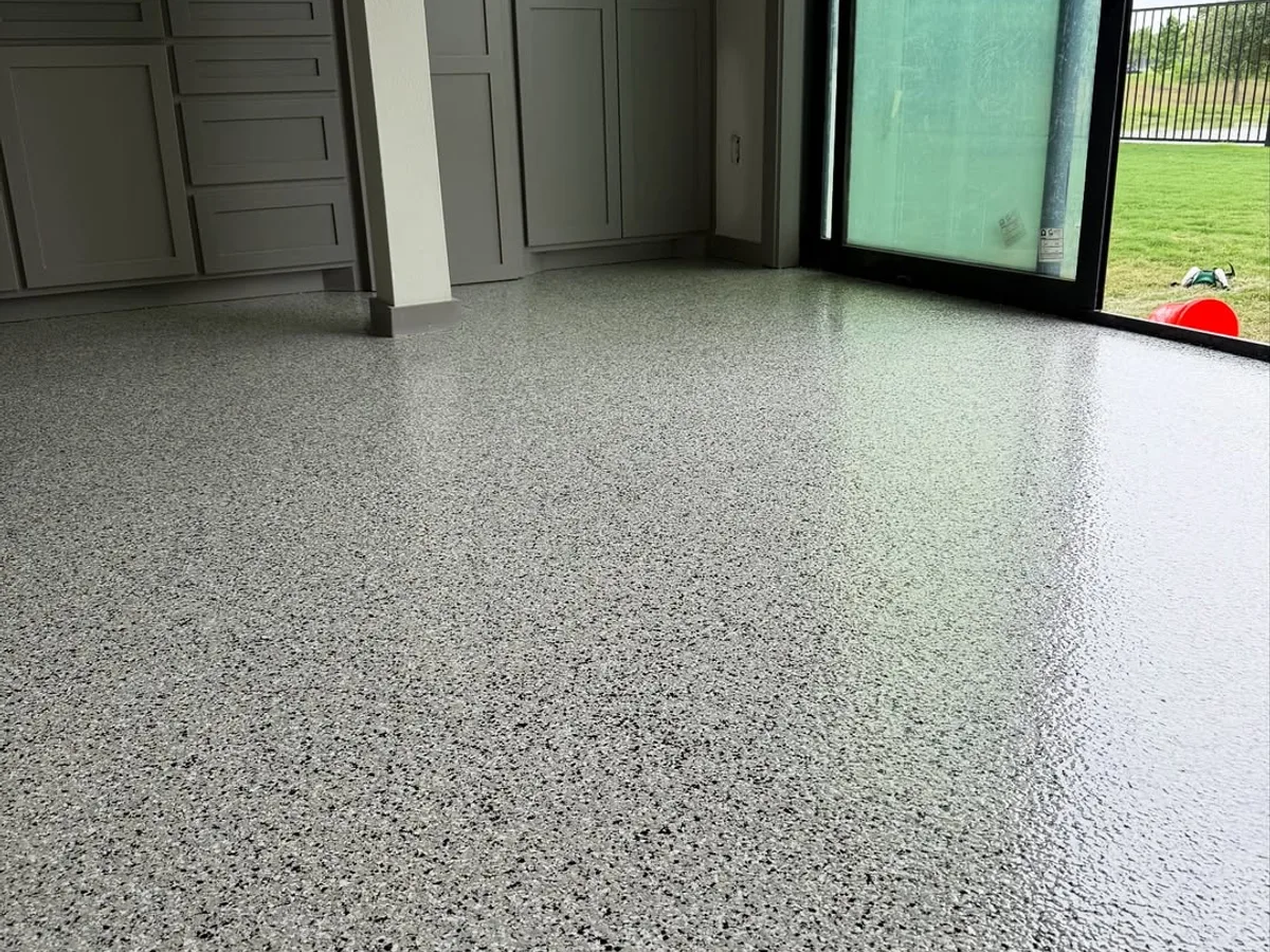 Completed epoxy garage floor coating in a Houston home