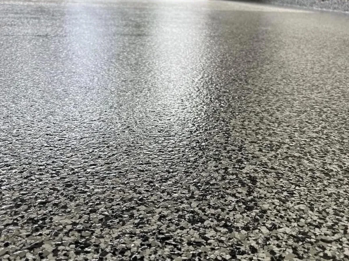 Completed epoxy garage floor coating in a Katy, TX home