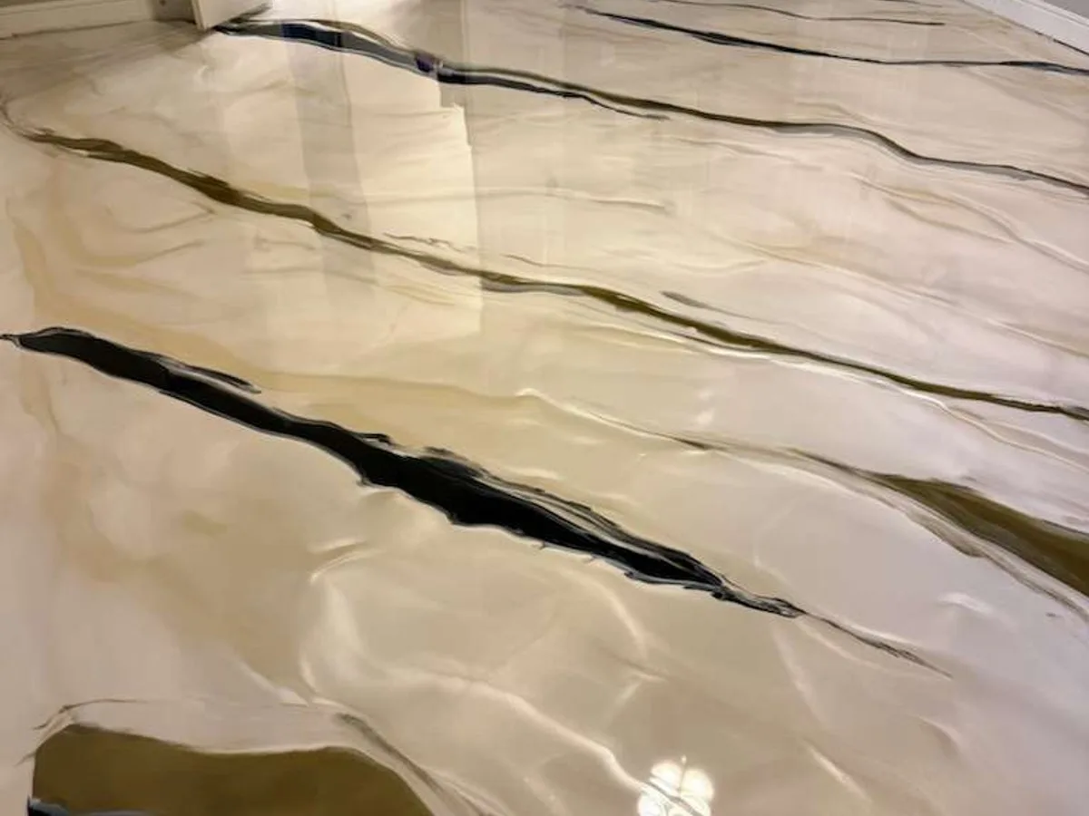 Custom marble-look metallic epoxy floor in a Houston home