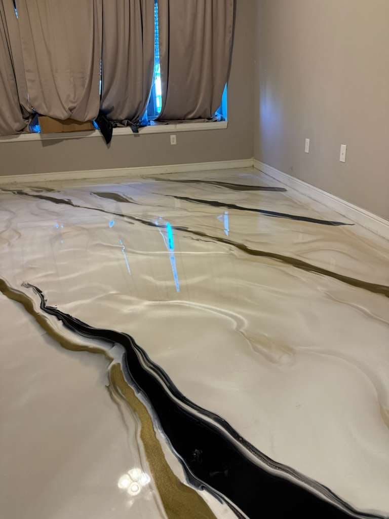 Pearl white marbled metallic floor with black and gold veins by a curtained window