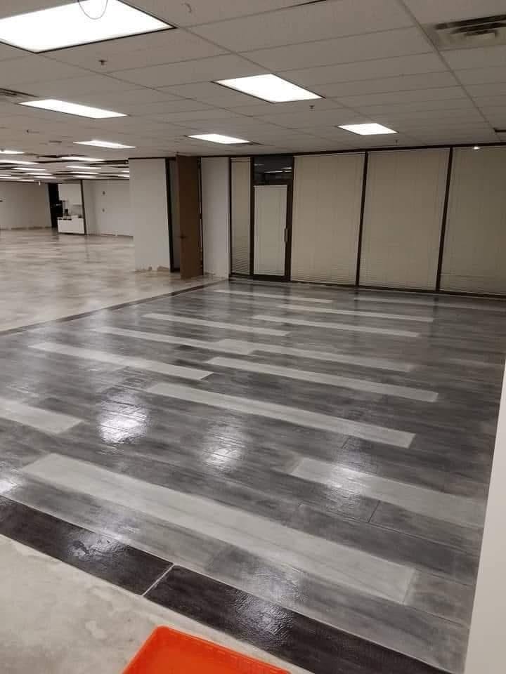 Gray plank-style concrete overlay floor in an office