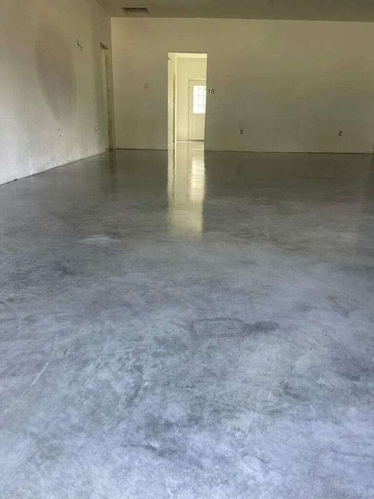 Polished gray concrete floor in an empty room