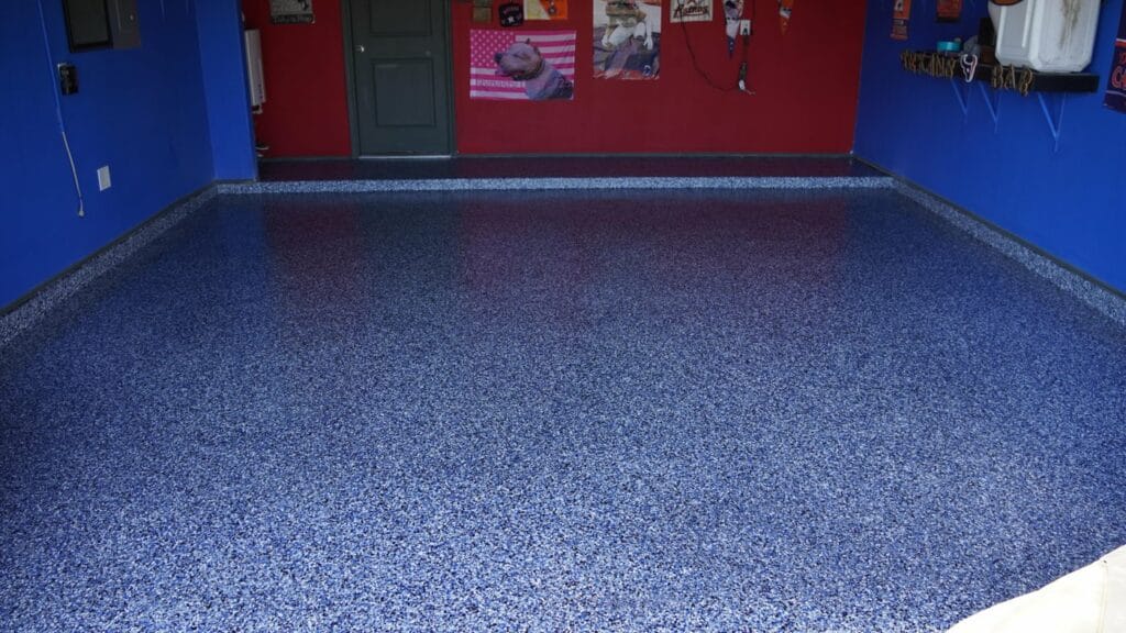 Blue speckled flake floor in a garage with blue walls