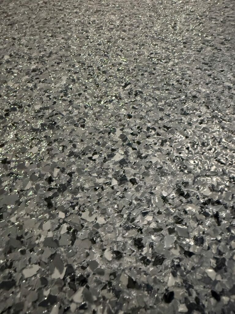 Close-up of a black and gray speckled flake floor