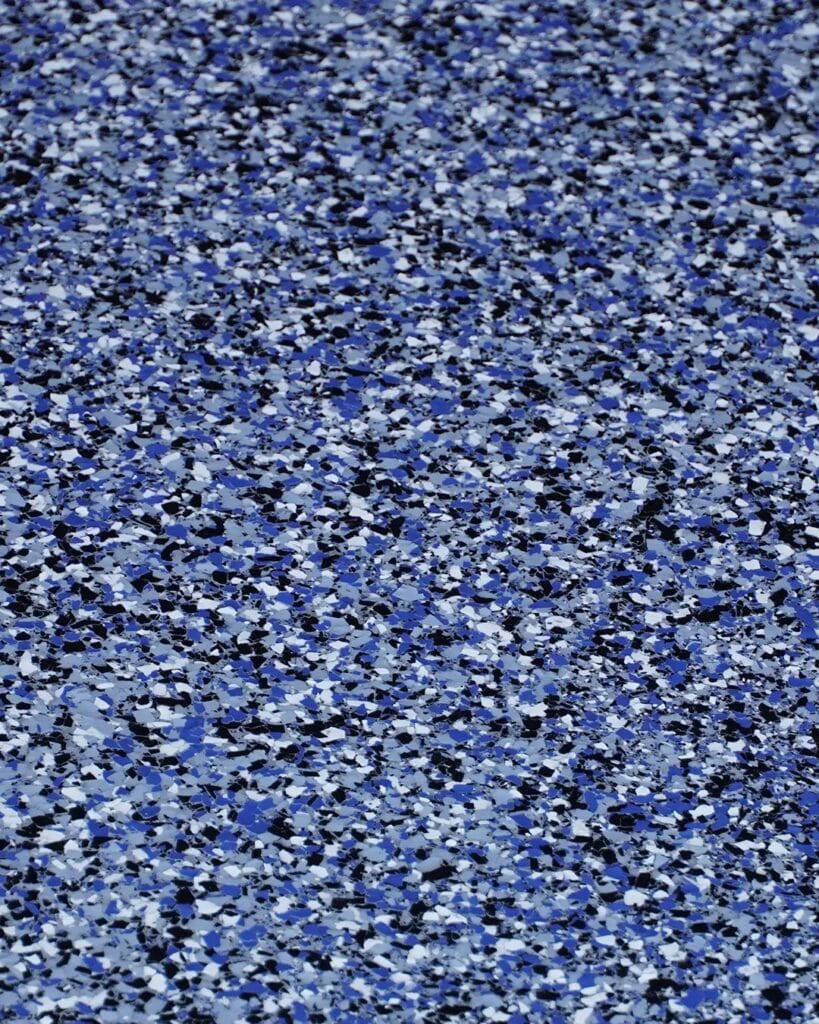 Close-up of a blue and white speckled flake finish