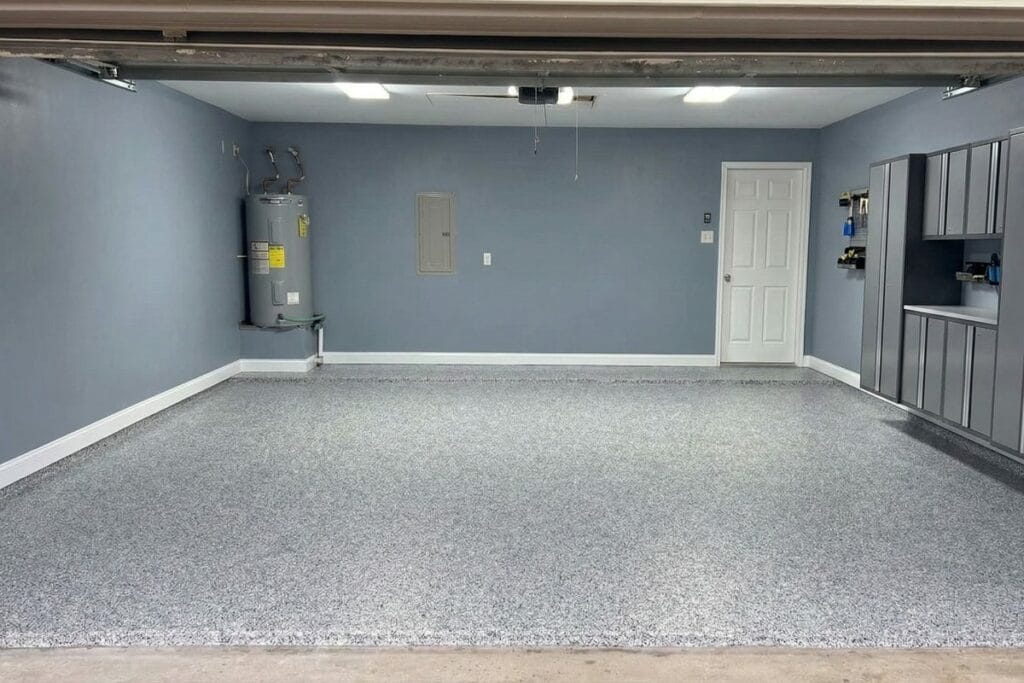Gray speckled flake garage floor with storage cabinets