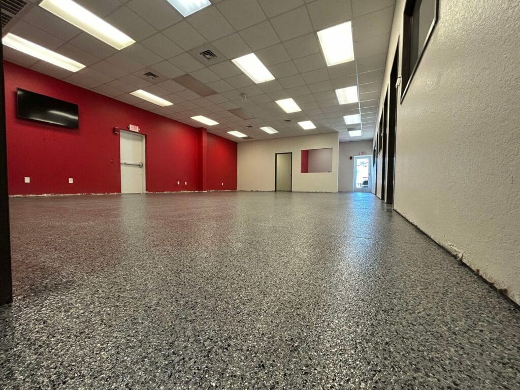 Speckled flake floor in a commercial shop with red walls